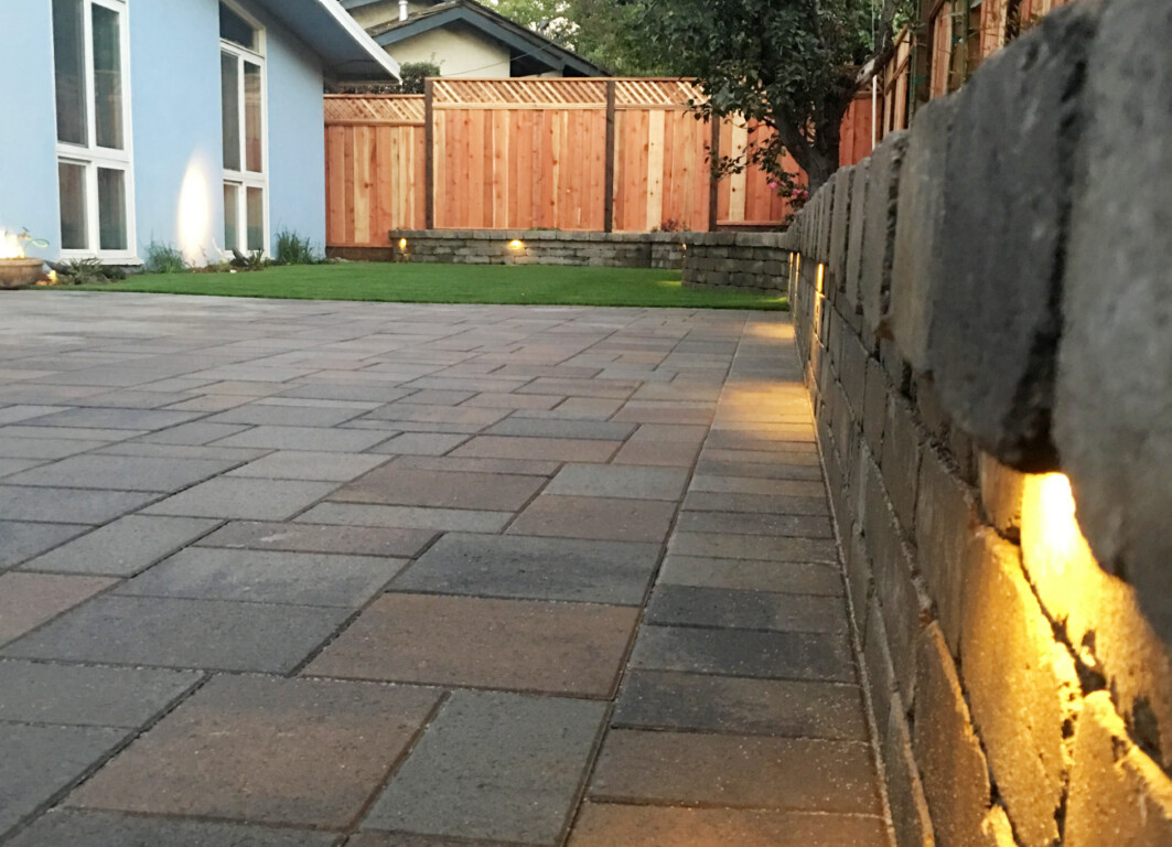 Concrete leveling and paver walkway with retaining wall and landscape lighting in Abilene, TX